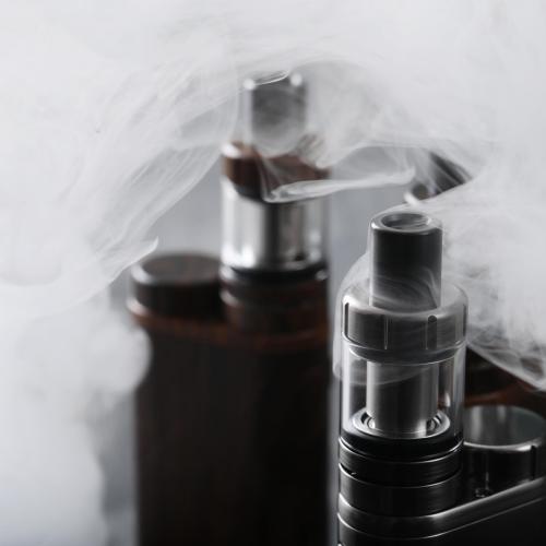 Vaping device on the wooden table